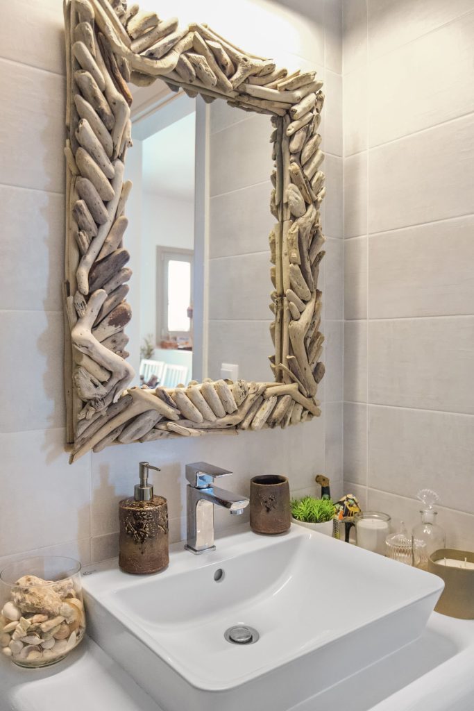 Bathroom with driftwood mirror